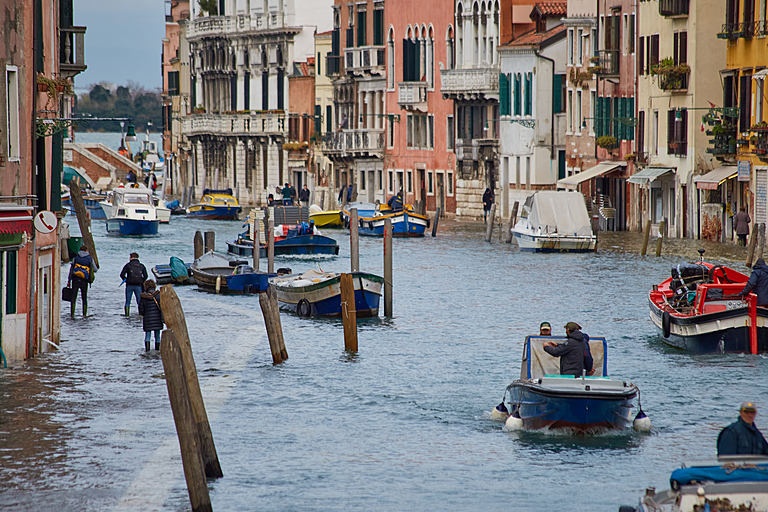 Fig. 5. High tide on a Venice canal: 1600-year-old city Venice has been a victim of both subsidence and global sea level rise fuelled by climate change (Adam Sébire / Climate Visuals).