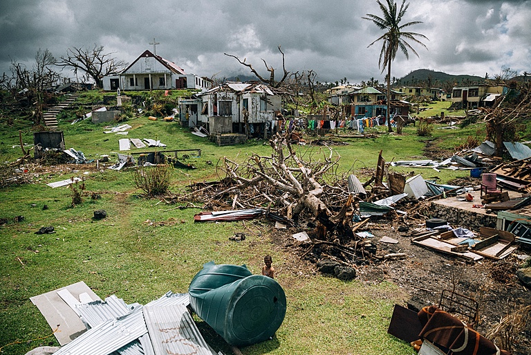 FIG. 2. Fiji after Cyclone Winston in 2016: Many villages were completely destroyed and people were left without food for several days, as access to the island was cut off (Vlad Sokhin / Climate Visuals).